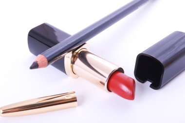 Lipstick and crayon on white clipart