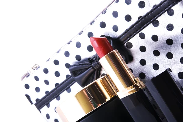 Cosmetics and purse over white Stock Image