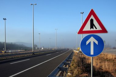 Signs in foggy motorway clipart