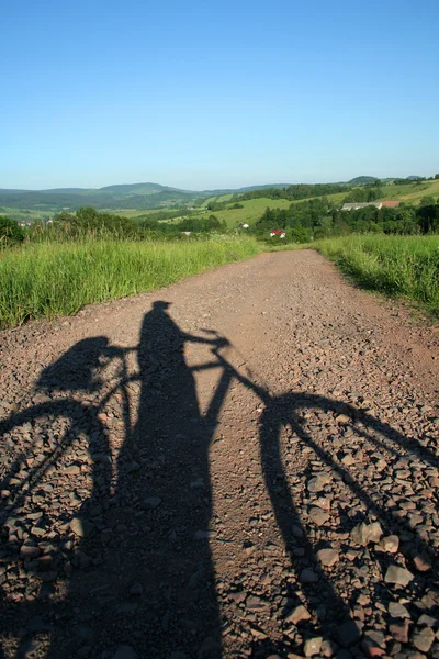Bicyclist's shadow — Stock Photo, Image
