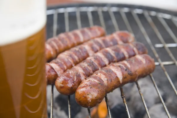 Tasty sausages with beer — Stock Photo, Image