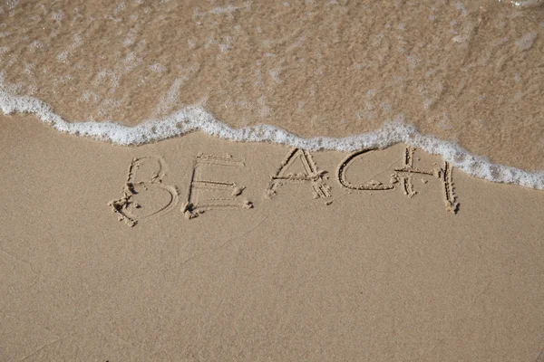 Beach inscription on the coast of Baltic sea — Stock Photo, Image