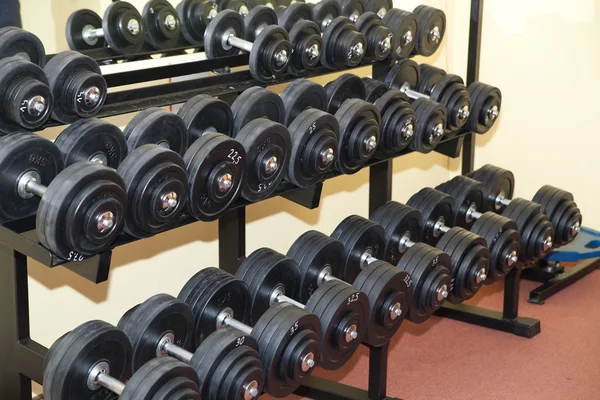 Lots of dumbbells — Stock Photo, Image
