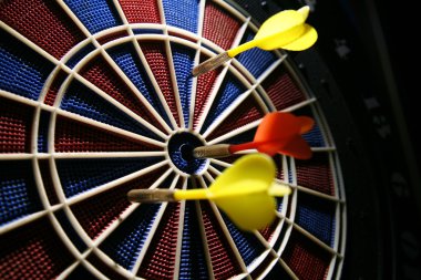 Dart boart with three darts clipart