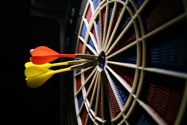 Dart board with three darts — Stock Photo, Image