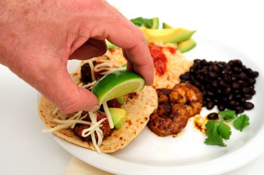 Putting Lime On Shrimp Taco clipart