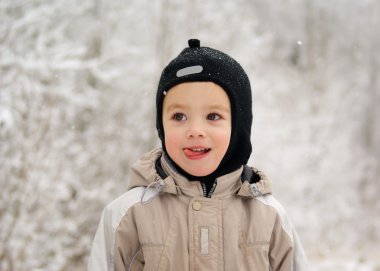 Boy on a winter walk clipart