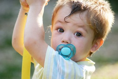 Little boy with pacifier clipart