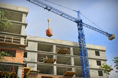 Construction building with crane clipart