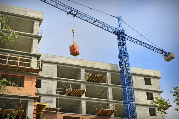 Construction building with crane — Stock Photo, Image