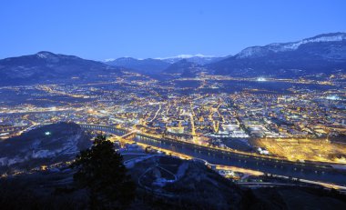 Overview of Trento in night time clipart