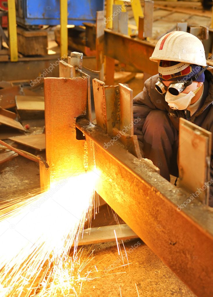 Worker using torch cutter to cut through Stock Photo by ©jordache 2523012