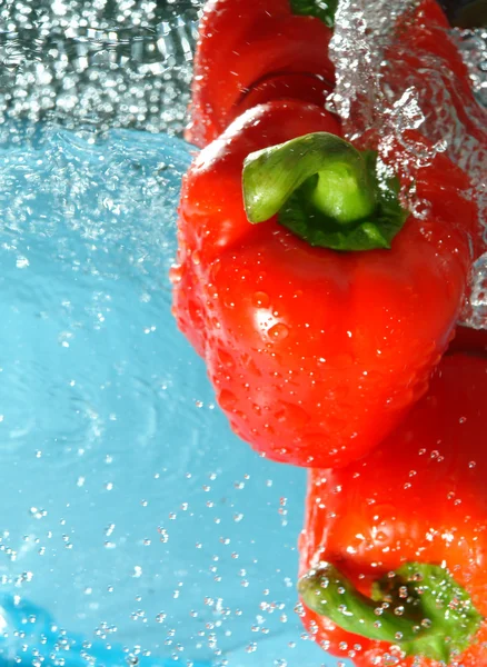 Peppers in water flows — Stock Photo, Image