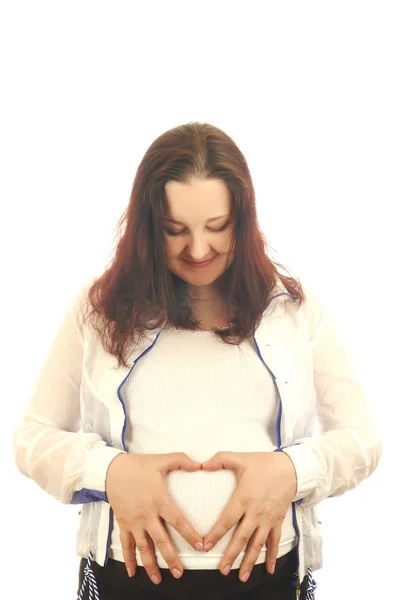 Беременная женщина с сердцем — стоковое фото