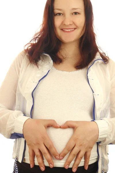 Беременная женщина и сердце — стоковое фото
