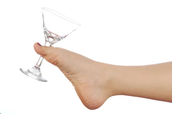 Vrouw benen en Martiniglas — Stockfoto