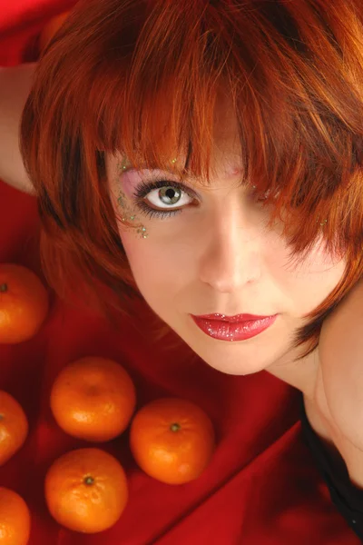 Woman and oranges portrait — Stock fotografie