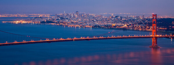 Golden Gate bridge and San Francisco skyline at night seen from Marine Headlands, California.