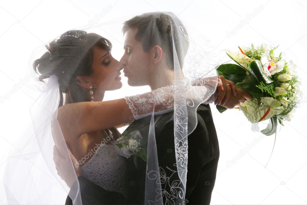 Kissing couple wedding portrait