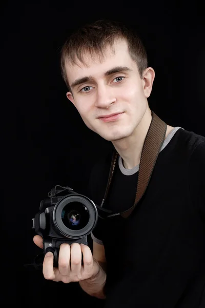 Молодой фотограф за работой — стоковое фото