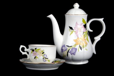 Ornate porcelain cup and teapot clipart