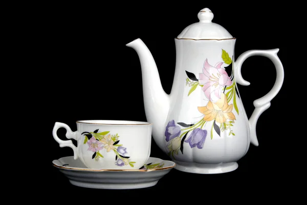 Copo de porcelana ornamentado e bule de chá — Fotografia de Stock