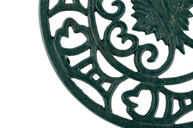 Fragment of an ornate cast iron trivet clipart