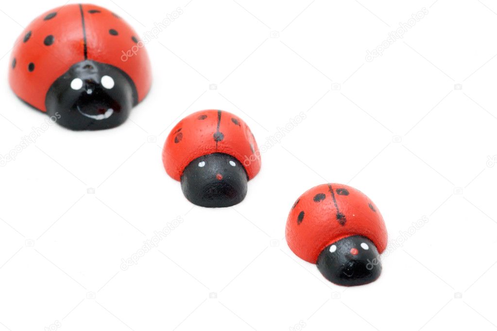 Diagonally arranged toy ladybirds