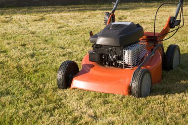 Motor driven lawnmower clipart