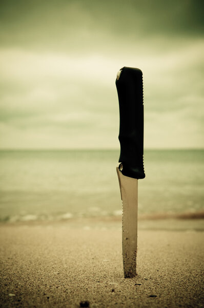 Knife in sand