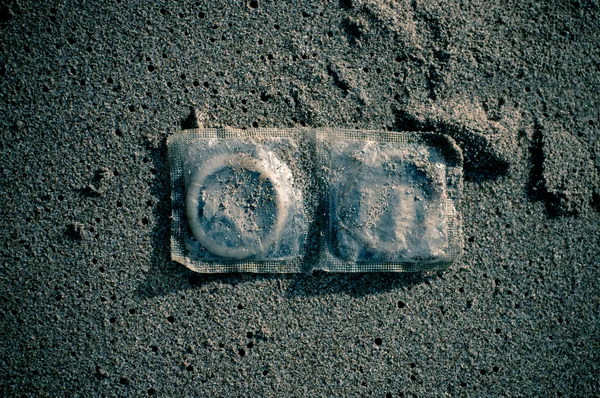 stock image Condoms in sand