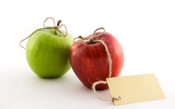 Κόκκινα και πράσινα μήλα με κάρτα Royalty Free Φωτογραφίες Αρχείου