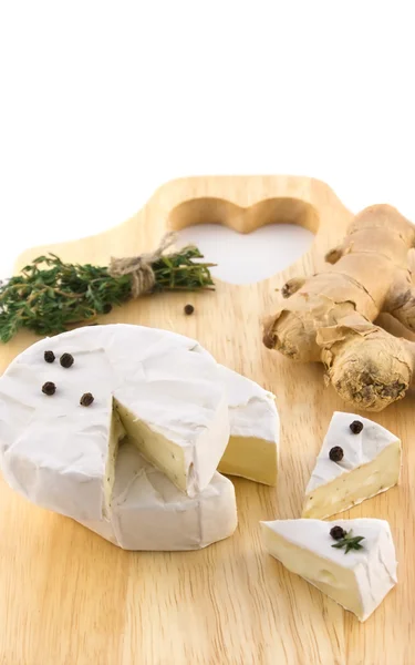 Cheese and a bundle of herbs — Stock Photo, Image