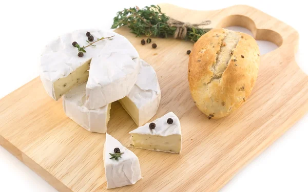 Cheese and a bundle of herbs — Stock Photo, Image