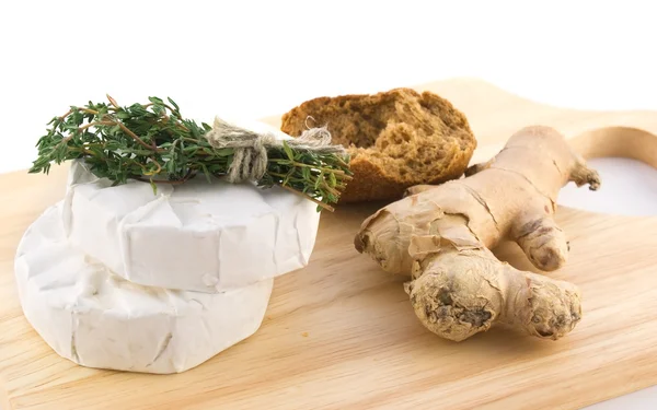 Cheese with white mold and a bundle of h — Stock Photo, Image