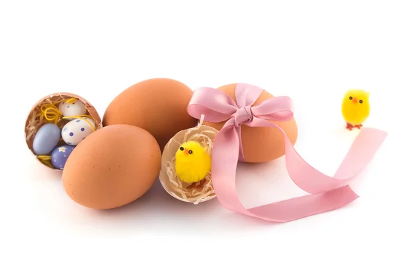 Natural easter eggs with pink bow — Stock Photo, Image