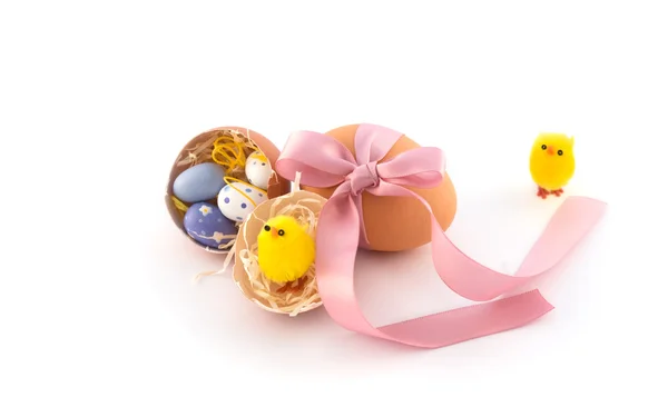 Natural easter eggs with pink bow — Stock Photo, Image