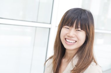 Asian business women smiling with office background clipart