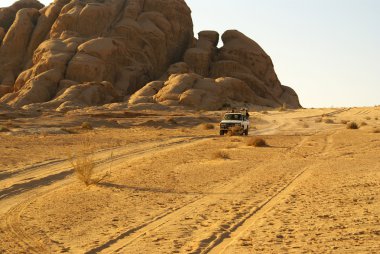 Jeep safari in desert clipart