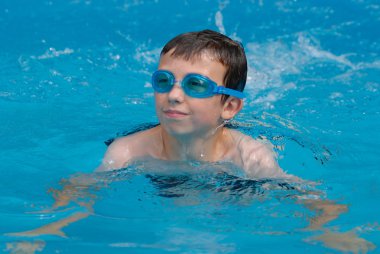 Young boy swimming clipart