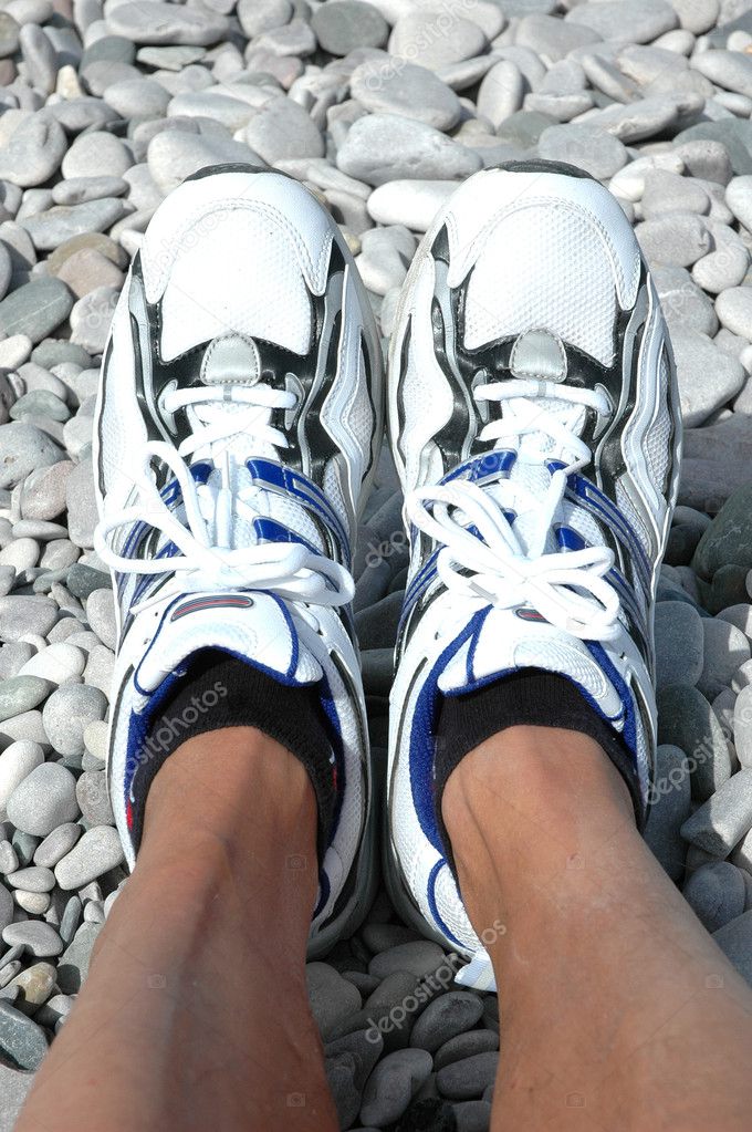 Running shoes on pebbles