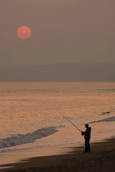 Pesca ao pôr do sol Fotos De Bancos De Imagens Sem Royalties