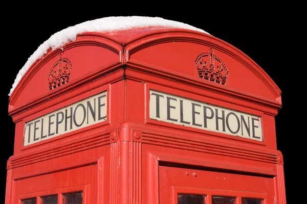 Telefonzelle mit Schnee, isoliert Stockbild
