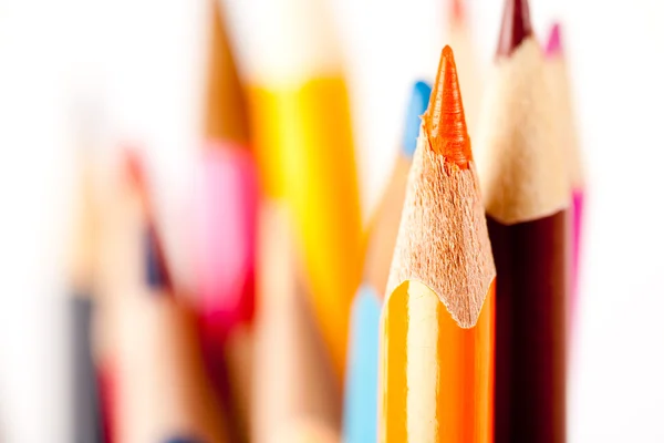 Many pencils over blurred background — Stock fotografie