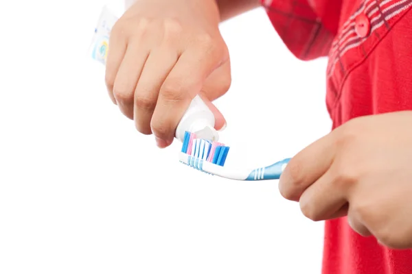 Mãos com pasta de dentes e escova de dentes — Fotografia de Stock