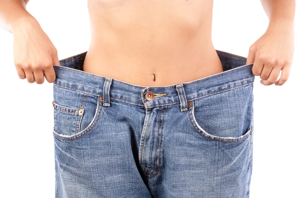Dame avec de gros jeans, concept de perte de poids — Photo