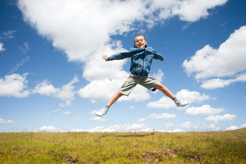 Little boy jumping for joy