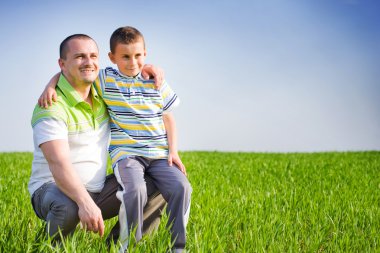 Father and son having good time outdoor clipart