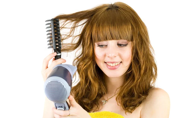 Menina loira usando secador de cabelo — Fotografia de Stock