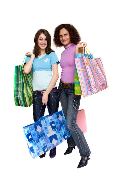 Junge Frauen beim Einkaufen, isoliert auf weiß — Stockfoto